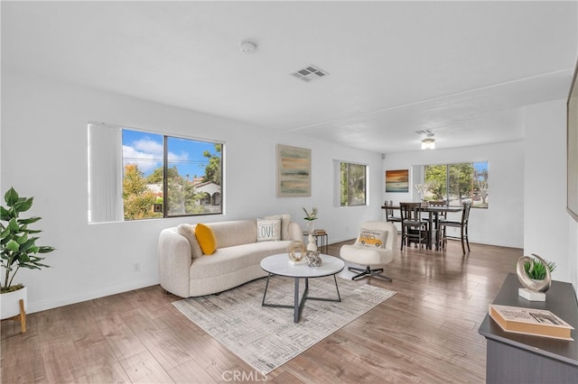 living room with wood finished floors and baseboards