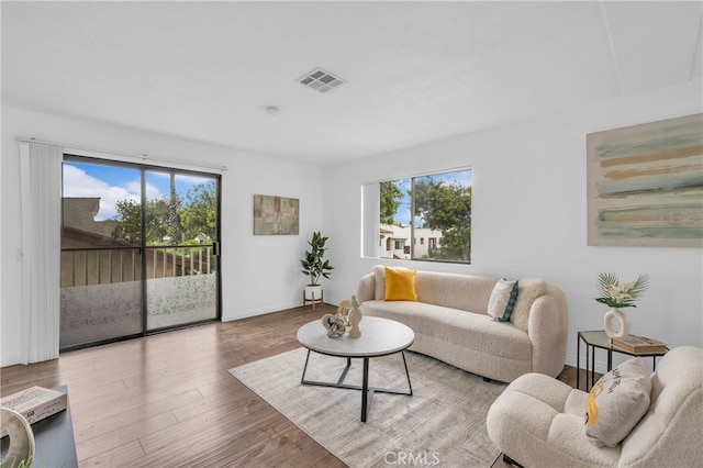 living area featuring wood finished floors and baseboards