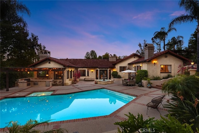 9 Maverick Ln, Bell Canyon, CA 91307 - view of swimming pool featuring exterior kitchen, a patio area, and a pool with connected hot tub