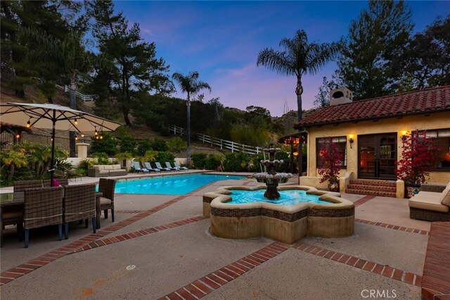 9 Maverick Ln, Bell Canyon, CA 91307 - pool at dusk with a patio and an outdoor pool