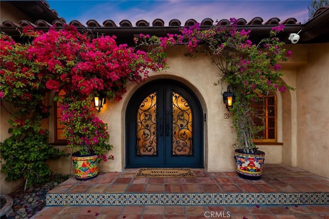 9 Maverick Ln, Bell Canyon, CA 91307 - property entrance with french doors and stucco siding