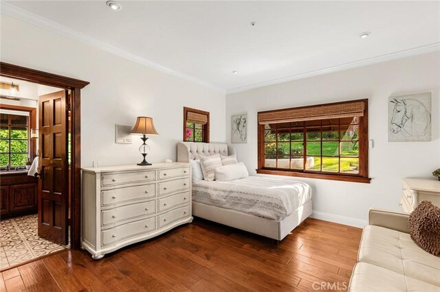 9 Maverick Ln, Bell Canyon, CA 91307 - bedroom featuring ornamental molding, multiple windows, dark wood finished floors, baseboards, and recessed lighting