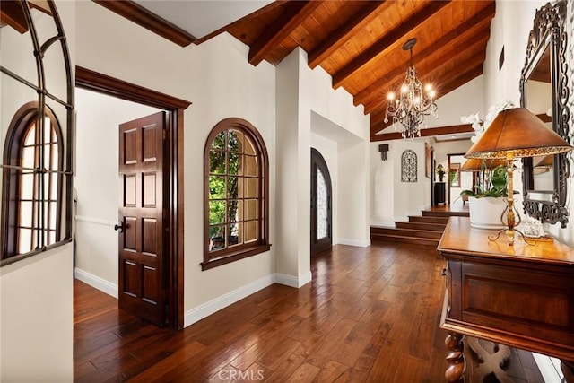 9 Maverick Ln, Bell Canyon, CA 91307 - foyer with arched walkways, a chandelier, baseboards, dark wood-type flooring, and wood ceiling