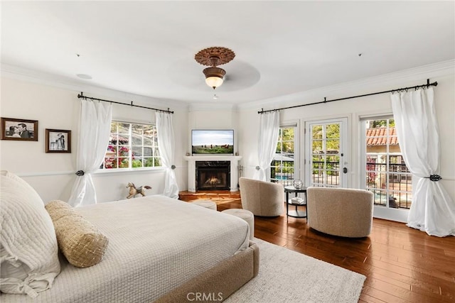 9 Maverick Ln, Bell Canyon, CA 91307 - bedroom with access to outside, multiple windows, wood-type flooring, ornamental molding, and a high end fireplace