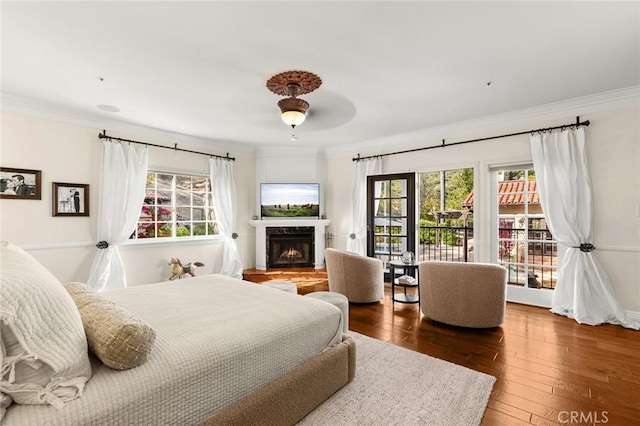 9 Maverick Ln, Bell Canyon, CA 91307 - bedroom with multiple windows, ornamental molding, a high end fireplace, hardwood / wood-style flooring, and a ceiling fan