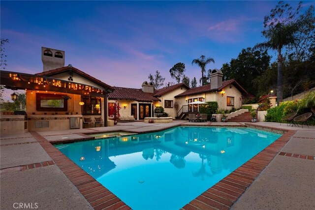 9 Maverick Ln, Bell Canyon, CA 91307 - view of pool featuring exterior kitchen, a patio, and a pool with connected hot tub