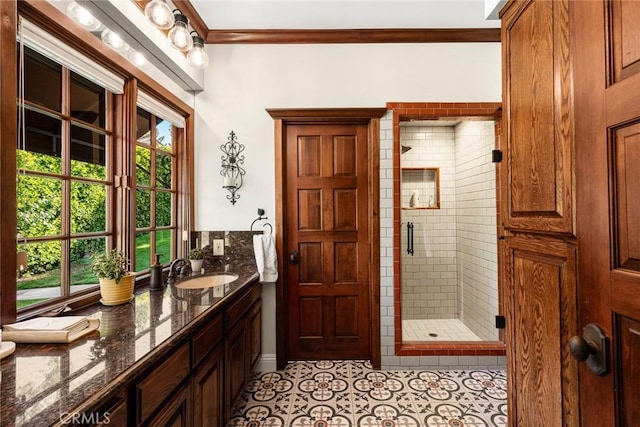 9 Maverick Ln, Bell Canyon, CA 91307 - bathroom featuring a stall shower, double vanity, ornamental molding, and tile patterned flooring