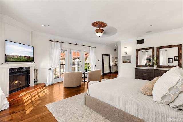 9 Maverick Ln, Bell Canyon, CA 91307 - bedroom featuring access to outside, ornamental molding, wood finished floors, a high end fireplace, and ceiling fan
