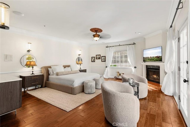 9 Maverick Ln, Bell Canyon, CA 91307 - bedroom with a high end fireplace, crown molding, dark wood-style floors, and recessed lighting
