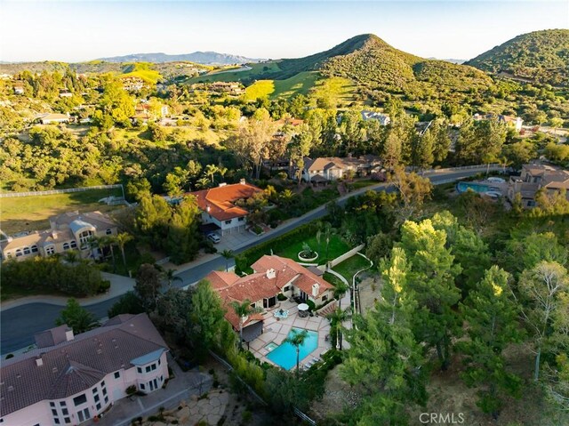 9 Maverick Ln, Bell Canyon, CA 91307 - aerial view of property and surrounding area with mountains, nearby suburban area, and a pool area