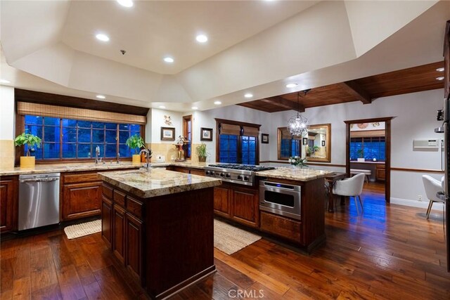 9 Maverick Ln, Bell Canyon, CA 91307 - kitchen with stainless steel appliances, a center island, dark wood-type flooring, decorative backsplash, and recessed lighting