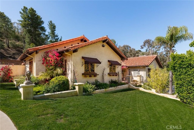 9 Maverick Ln, Bell Canyon, CA 91307 - view of front of property with a front yard, stucco siding, and a tiled roof