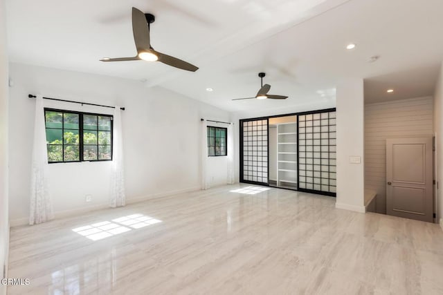 empty room featuring ceiling fan, baseboards, wood finished floors, and recessed lighting