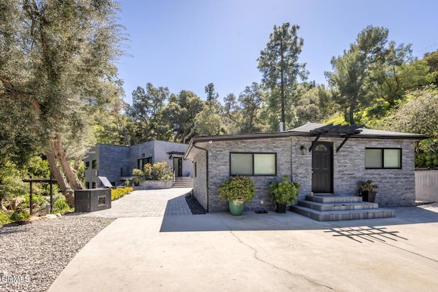 contemporary house with stone siding