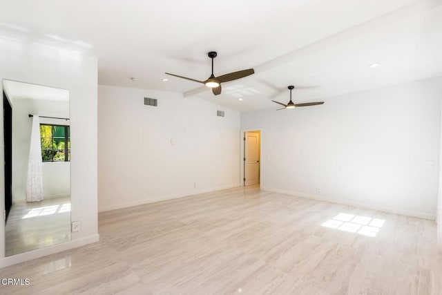 empty room featuring ceiling fan, vaulted ceiling, baseboards, and recessed lighting