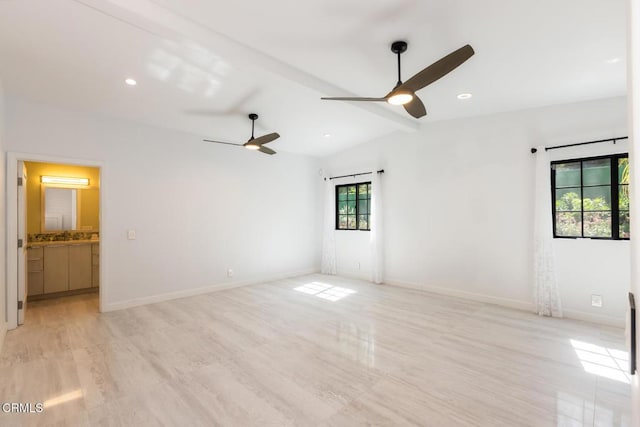 spare room with ceiling fan, lofted ceiling, light wood-style floors, baseboards, and recessed lighting