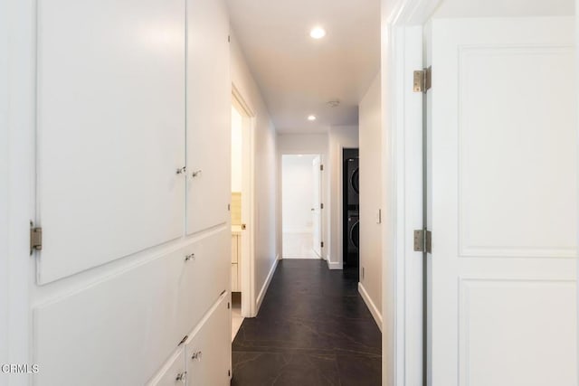 7572 Mcgroarty Ter, Tujunga, CA 91042 - hallway featuring stacked washing machine and dryer, recessed lighting, and baseboards
