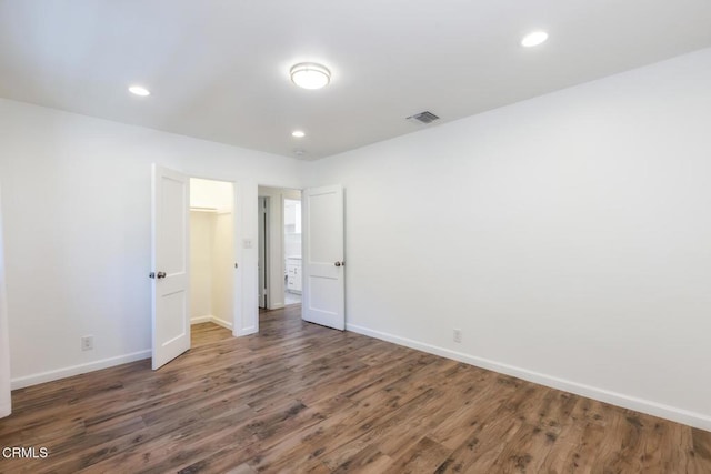 7580 Mcgroarty Ter, Tujunga, CA 91042 - unfurnished bedroom featuring wood finished floors, baseboards, and recessed lighting