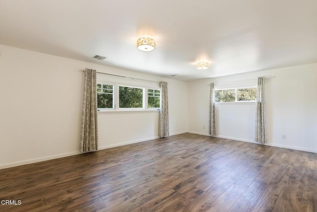 7580 Mcgroarty Ter, Tujunga, CA 91042 - empty room featuring healthy amount of natural light, wood finished floors, and baseboards
