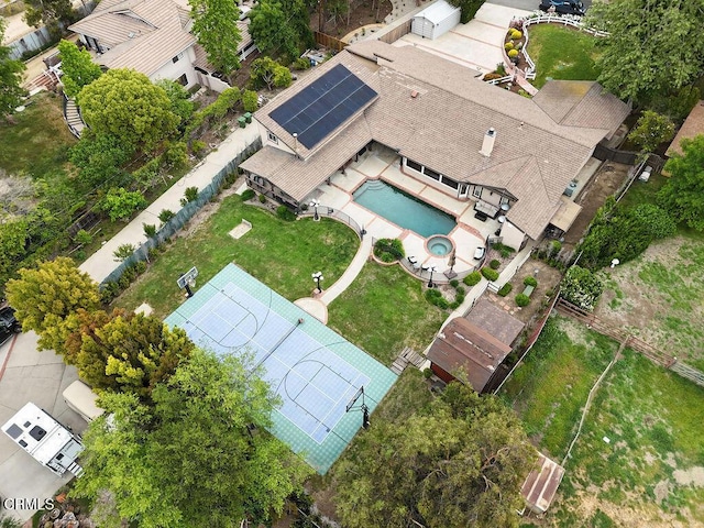 aerial view of property and surrounding area featuring a pool