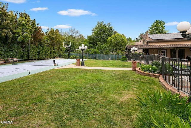 view of yard with community basketball court