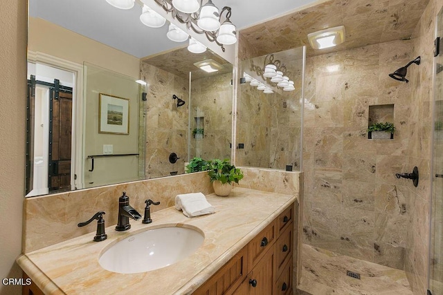 bathroom featuring vanity and a tile shower
