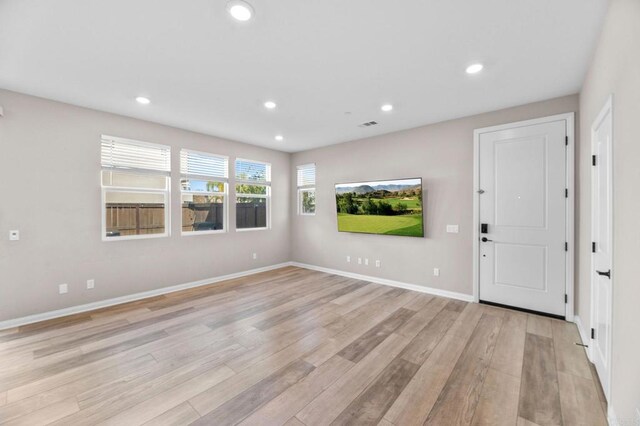 2167 Trevi Cir, Chula Vista, CA 91913 - unfurnished living room with light wood-type flooring and recessed lighting