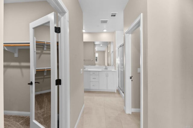 2167 Trevi Cir, Chula Vista, CA 91913 - hallway featuring baseboards and light tile patterned flooring