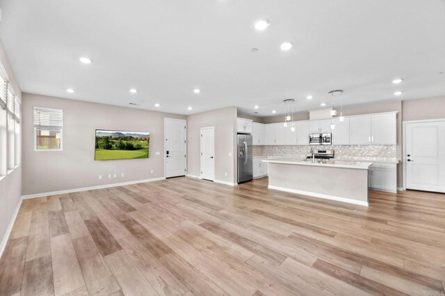 2167 Trevi Cir, Chula Vista, CA 91913 - unfurnished living room featuring recessed lighting and light wood-type flooring