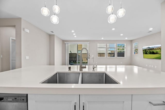 2167 Trevi Cir, Chula Vista, CA 91913 - kitchen with dishwasher, recessed lighting, light countertops, decorative light fixtures, and white cabinetry