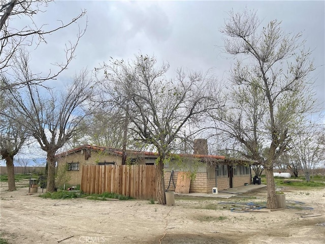 view of property exterior with fence
