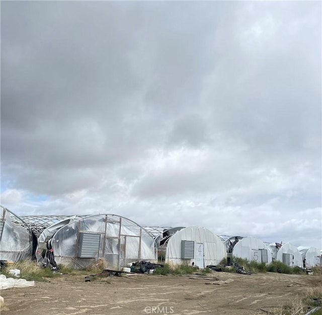 view of property's community with an outdoor structure and an exterior structure