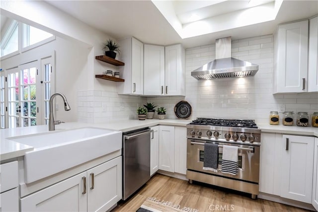 29521 Via, San Sebastian, Laguna Niguel, CA 92677 - kitchen featuring wall chimney exhaust hood, stainless steel appliances, a sink, open shelves, and light countertops