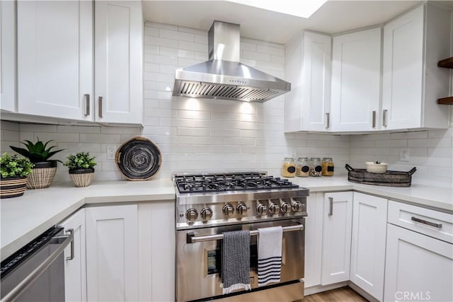 29521 Via, San Sebastian, Laguna Niguel, CA 92677 - kitchen featuring wall chimney range hood, stainless steel appliances, tasteful backsplash, white cabinetry, and light countertops