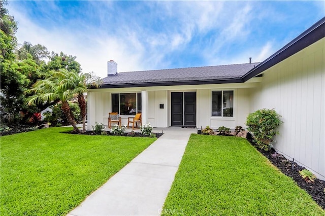 29521 Via, San Sebastian, Laguna Niguel, CA 92677 - view of front facade with a front lawn, a chimney, and covered porch