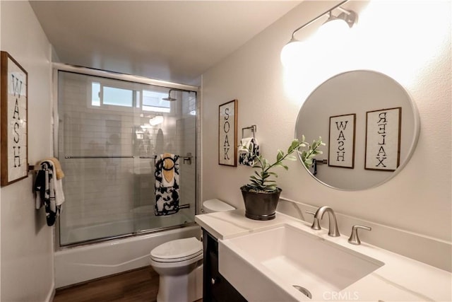29521 Via, San Sebastian, Laguna Niguel, CA 92677 - bathroom with vanity, bath / shower combo with glass door, toilet, and wood finished floors