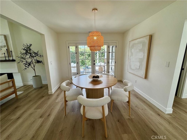 29521 Via, San Sebastian, Laguna Niguel, CA 92677 - dining room featuring light wood-style flooring, baseboards, and french doors