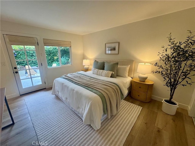 29521 Via, San Sebastian, Laguna Niguel, CA 92677 - bedroom featuring access to outside, wood finished floors, and baseboards