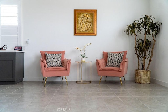 2373 Crater Ave, Rialto, CA 92377 - living area featuring light tile patterned floors and baseboards
