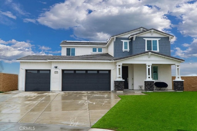 2373 Crater Ave, Rialto, CA 92377 - craftsman house with covered porch, concrete driveway, a garage, stucco siding, and solar panels