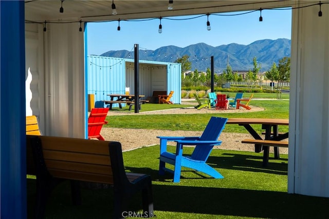2373 Crater Ave, Rialto, CA 92377 - view of playground with a mountain view and a lawn