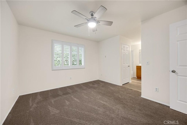 unfurnished bedroom with carpet floors, baseboards, and a ceiling fan