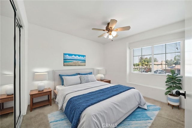 1044 Jude Ct, San Jacinto, CA 92583 - bedroom featuring light colored carpet, a ceiling fan, and a closet