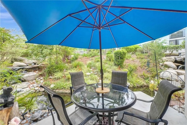 view of patio featuring outdoor dining area