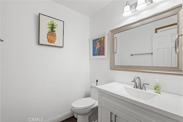 5048 W 121st St, Hawthorne, CA 90250 - bathroom with toilet, vanity, wood finished floors, and baseboards