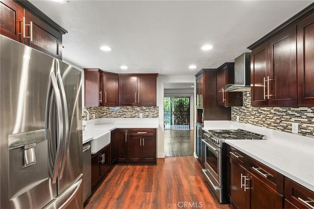 5048 W 121st St, Hawthorne, CA 90250 - kitchen featuring stainless steel appliances, wall chimney exhaust hood, dark wood-style flooring, light countertops, and recessed lighting