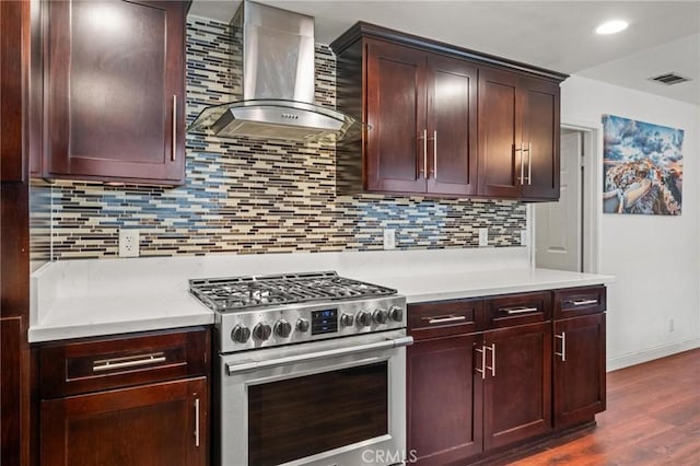 5048 W 121st St, Hawthorne, CA 90250 - kitchen featuring high end range, wall chimney exhaust hood, light countertops, decorative backsplash, and recessed lighting