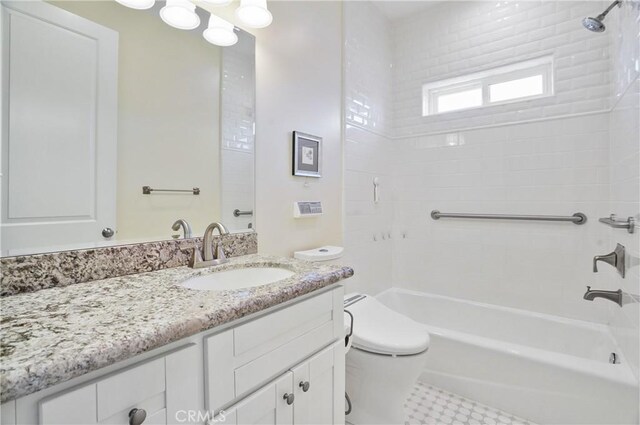 full bathroom with toilet, vanity, and tub / shower combination