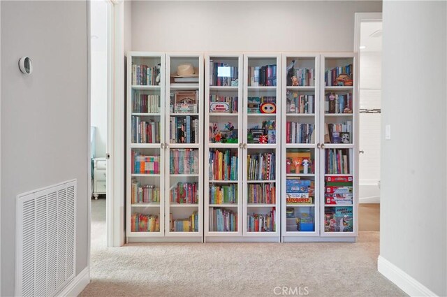 detailed view of carpet flooring and baseboards