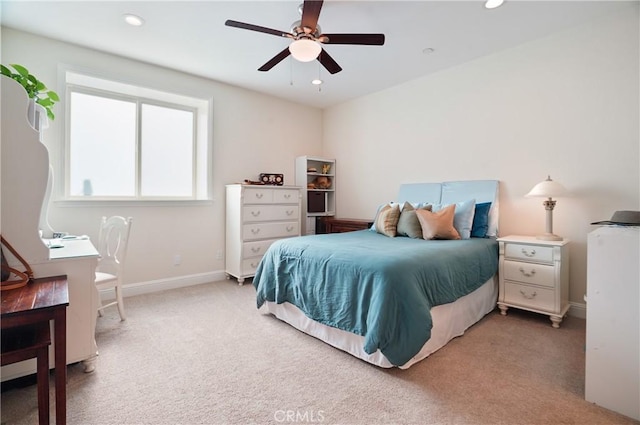 bedroom featuring light colored carpet, baseboards, recessed lighting, and a ceiling fan